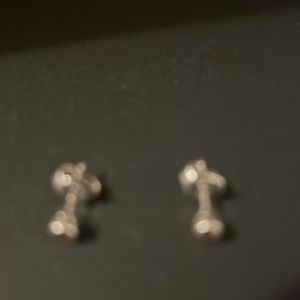 Diamond earrings, 0.05 in size.